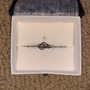 Two hearts one diamond ring.